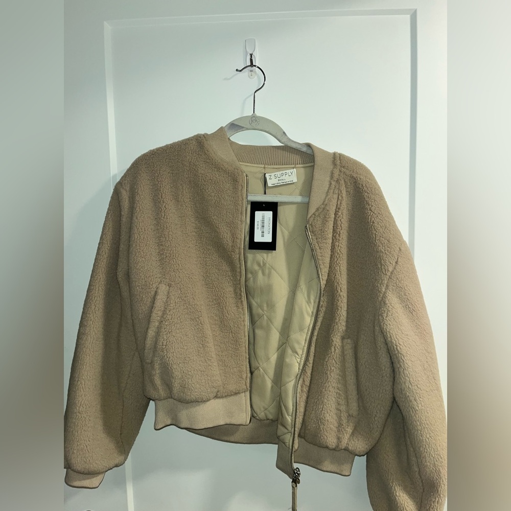 Never worn Bronxton reversible tan bomber jacket. US sized small.